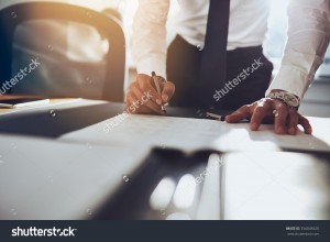 stock-photo-close-up-business-man-signing-contract-making-a-deal-classic-business-334043420
