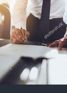 stock-photo-close-up-business-man-signing-contract-making-a-deal-classic-business-334043420-vertical