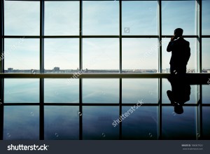 stock-photo-outline-of-office-worker-speaking-on-the-phone-by-the-window-186067922